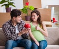 Young couple saving money for baby to be born Royalty Free Stock Photo