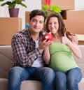 Young couple saving money for baby to be born Royalty Free Stock Photo