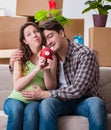 Young couple saving money for baby to be born Royalty Free Stock Photo