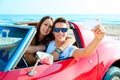 Young couple selfie happy in res car on beach