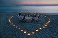 A young couple share a romantic dinner on the beach Royalty Free Stock Photo