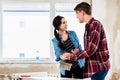 Young couple sharing tools while working on improvement of their Royalty Free Stock Photo