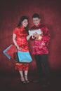 Young couple with shopping bags and tablet Royalty Free Stock Photo