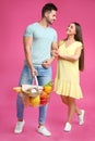 Young couple with shopping basket full of products Royalty Free Stock Photo