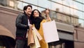 Young couple shopping together in boutiques and walking outdoors Royalty Free Stock Photo