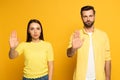 Young couple showing stop gesture at camera Royalty Free Stock Photo