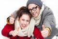 Young couple showing thumbs up Royalty Free Stock Photo