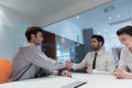 Young couple signing contract documents on partners back Royalty Free Stock Photo