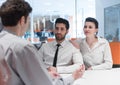 Young couple signing contract documents on partners back Royalty Free Stock Photo