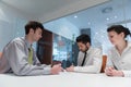 Young couple signing contract documents on partners back Royalty Free Stock Photo