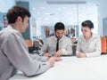 Young couple signing contract documents on partners back Royalty Free Stock Photo