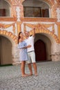 Young couple siteseeing on a hot summer afternoon on a paved street