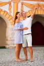 Young couple siteseeing on a hot summer afternoon on a paved street