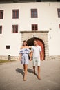 Young couple siteseeing on a hot summer afternoon on a paved street