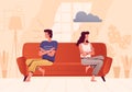 A young couple sits on opposite sides of the couch and quarrels. People spend time at home. The psychological concept of