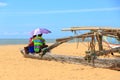 Young couple sitting at the beach Royalty Free Stock Photo