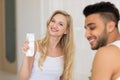 Young Couple Sitting In Bed, Smiling Woman Man Hold Condom Lovers Contraception Protection