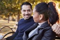 Young couple sitting on bench in Brooklyn park, close up Royalty Free Stock Photo