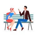 Young couple sitting on a bench Royalty Free Stock Photo