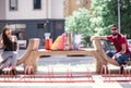 Young couple sitting on a bench after shopping Royalty Free Stock Photo