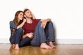 Young couple sitting on floor