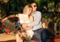 Young couple sitting on the garden bench Royalty Free Stock Photo