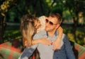 Young couple sitting on the garden bench Royalty Free Stock Photo