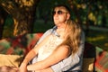 Young couple sitting on the garden bench Royalty Free Stock Photo