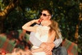 Young couple sitting on the garden bench Royalty Free Stock Photo