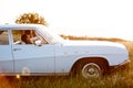 Young couple sitting inside retro car Royalty Free Stock Photo