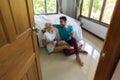 Young Couple Sitting Near Bed, Morning Happy Smile Hispanic Man And Woman Using Cell Smart Phone Royalty Free Stock Photo