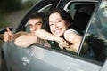 Young couple sitting in the new car Royalty Free Stock Photo