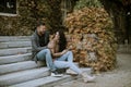 Young couple sitting on outdoor stairs on a autumn day Royalty Free Stock Photo