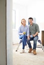 Young Couple Sitting In Property Being Renovated Royalty Free Stock Photo