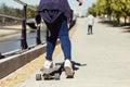 Young couple skateboarding in the street. Royalty Free Stock Photo