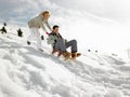 Young Couple Sledding