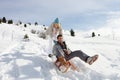 Young Couple Sledding