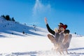 Young Couple Sledding And Enjoying On Sunny Winter Day Royalty Free Stock Photo