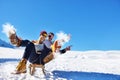 Young Couple Sledding And Enjoying On Sunny Winter Day Royalty Free Stock Photo