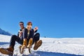 Young Couple Sledding And Enjoying On Sunny Winter Day Royalty Free Stock Photo