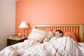 Young Couple Sleeping in Bed Royalty Free Stock Photo