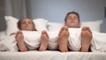 Young couple sleeping in bed, view of healthy feet, antifungal spray effect Royalty Free Stock Photo