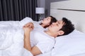 Couple sleeping on a comfortable bed in bedroom at home Royalty Free Stock Photo