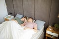 Young couple sleeping peacefully in bed under white blanket Royalty Free Stock Photo