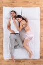 Young couple sleeping together on bed Royalty Free Stock Photo