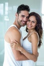 Young couple smiling while embracing at home Royalty Free Stock Photo