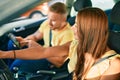 Young couple smiling happy driving car and using gps navigator smartphone Royalty Free Stock Photo