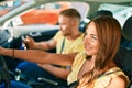 Young couple smiling happy driving car and using gps navigator smartphone Royalty Free Stock Photo