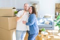 Young couple smiling very happy showing keys of new home, moving and buying new apartmet concept Royalty Free Stock Photo