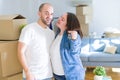 Young couple smiling very happy showing keys of new home, moving and buying new apartmet concept Royalty Free Stock Photo